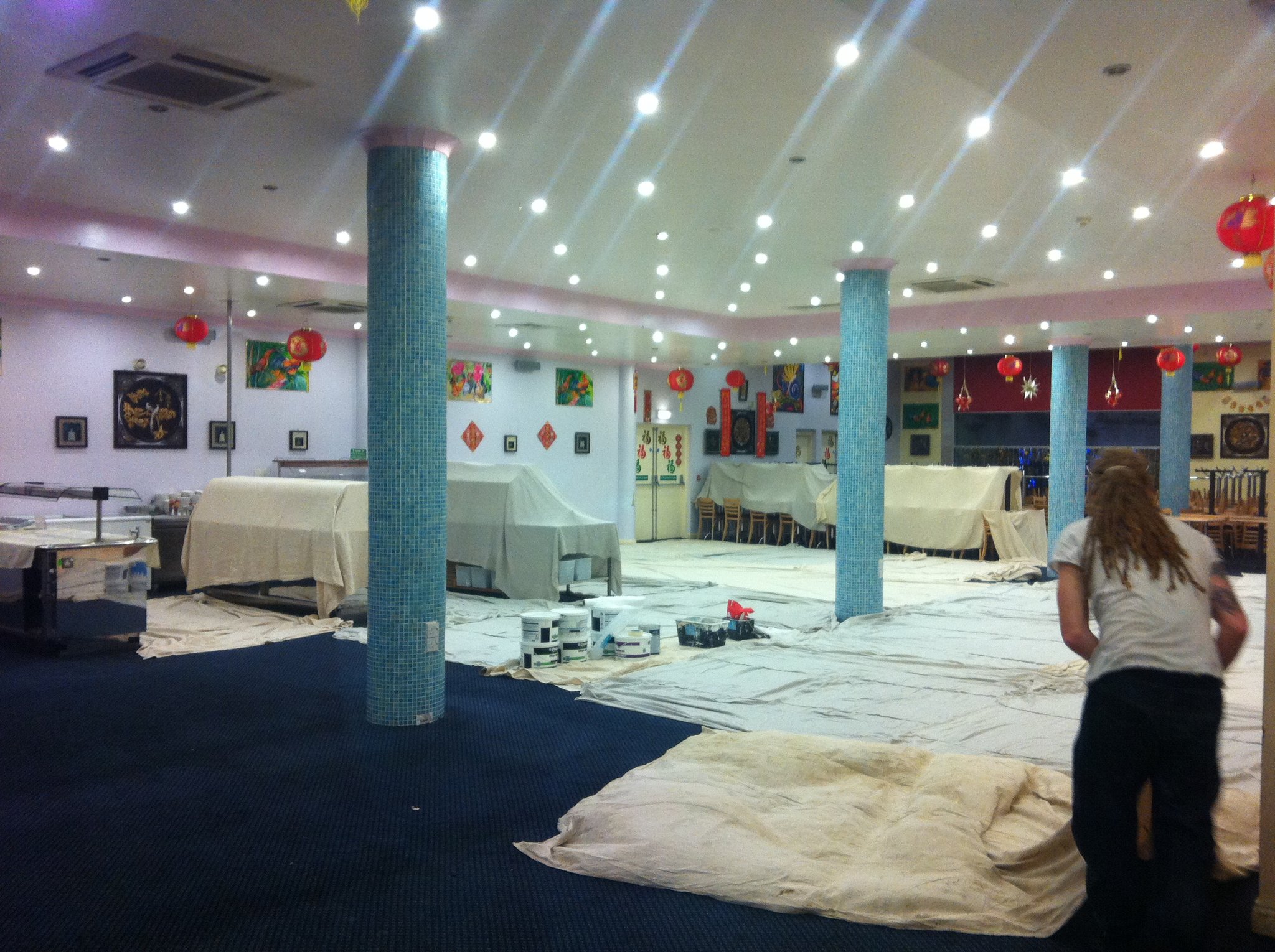 Large commercial interior sheeted and protected during decorating