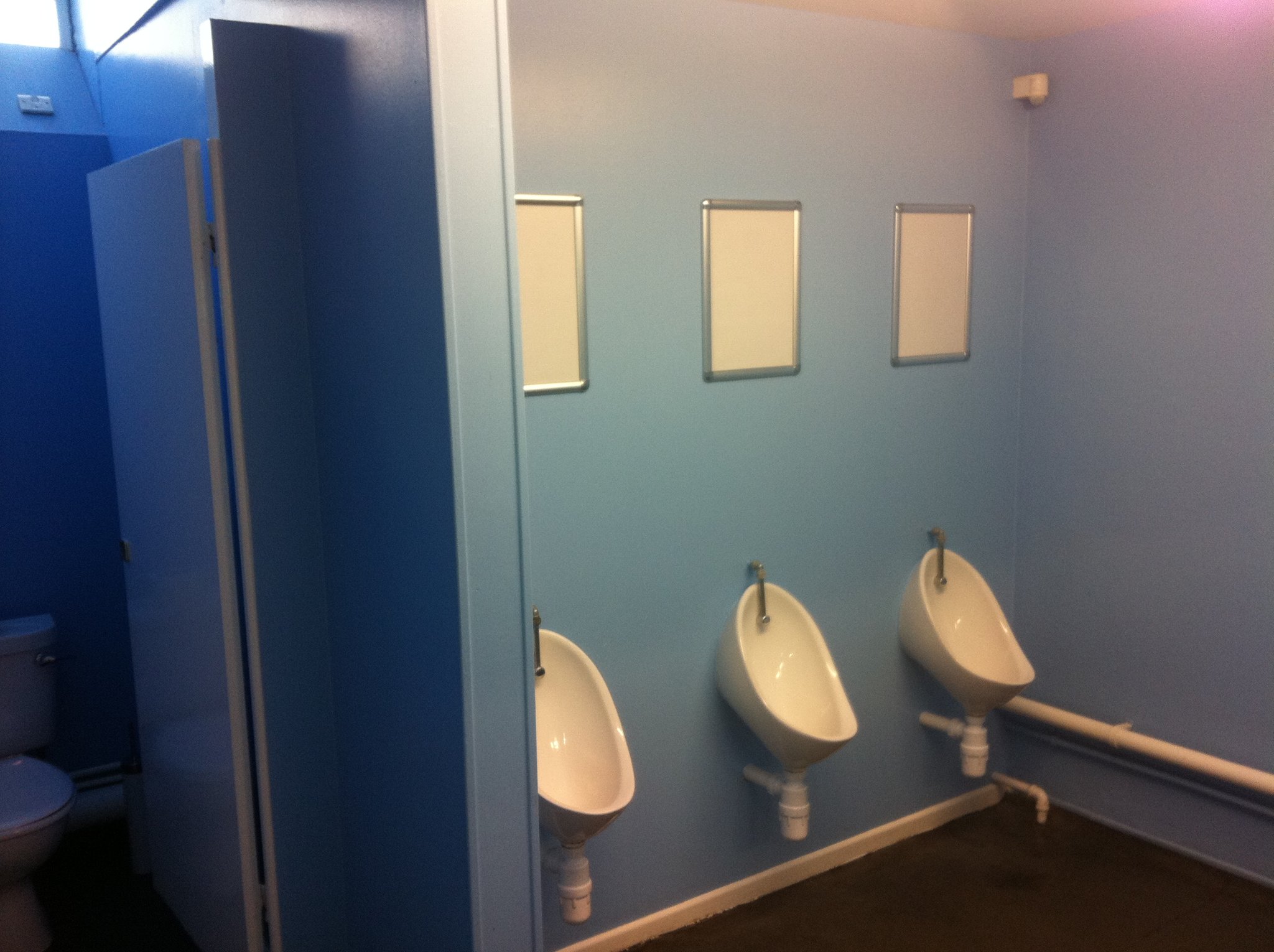 Commercial washroom painted in pale blue