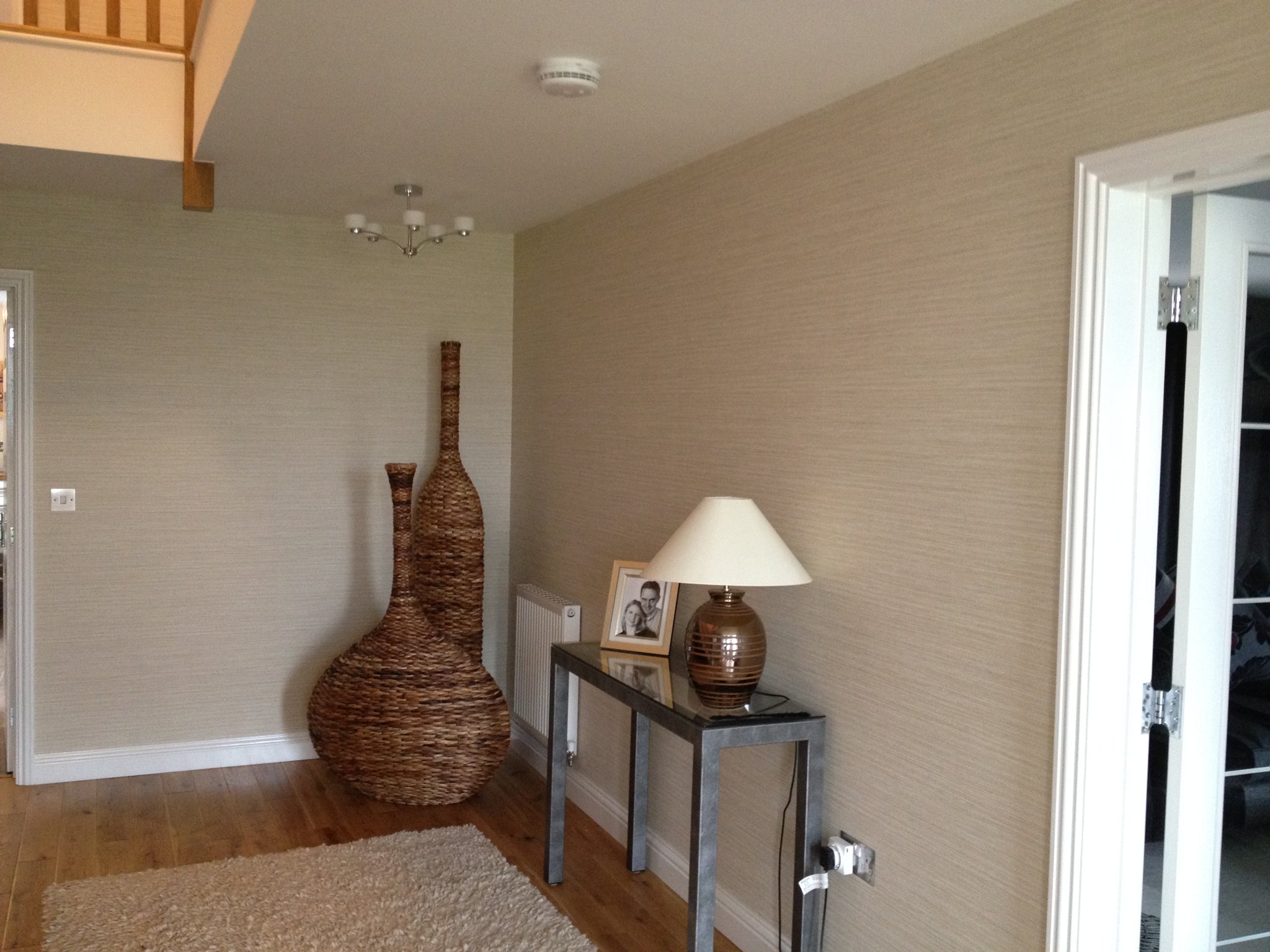 Grasscloth wallpaper in a calm sitting room