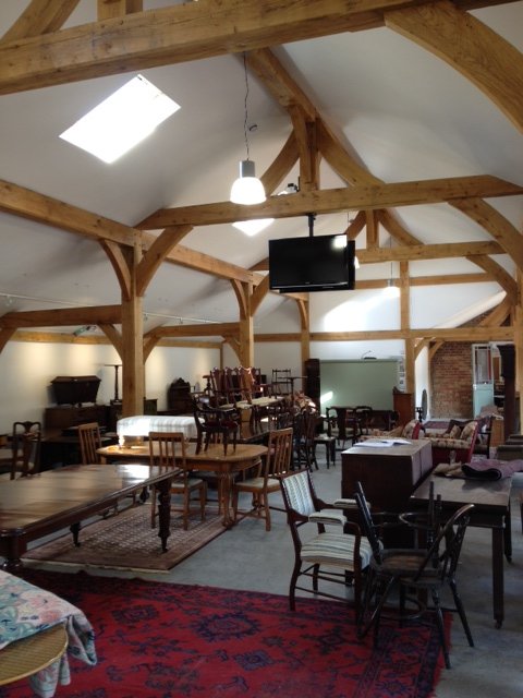 Oak framed barn interior with exposed trusses