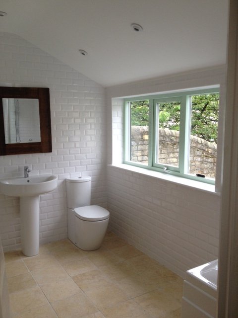 Bright white bathroom with brick tiles