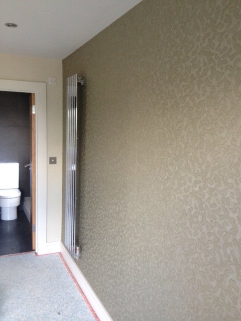 Shimmering patterned wallpaper in a hallway