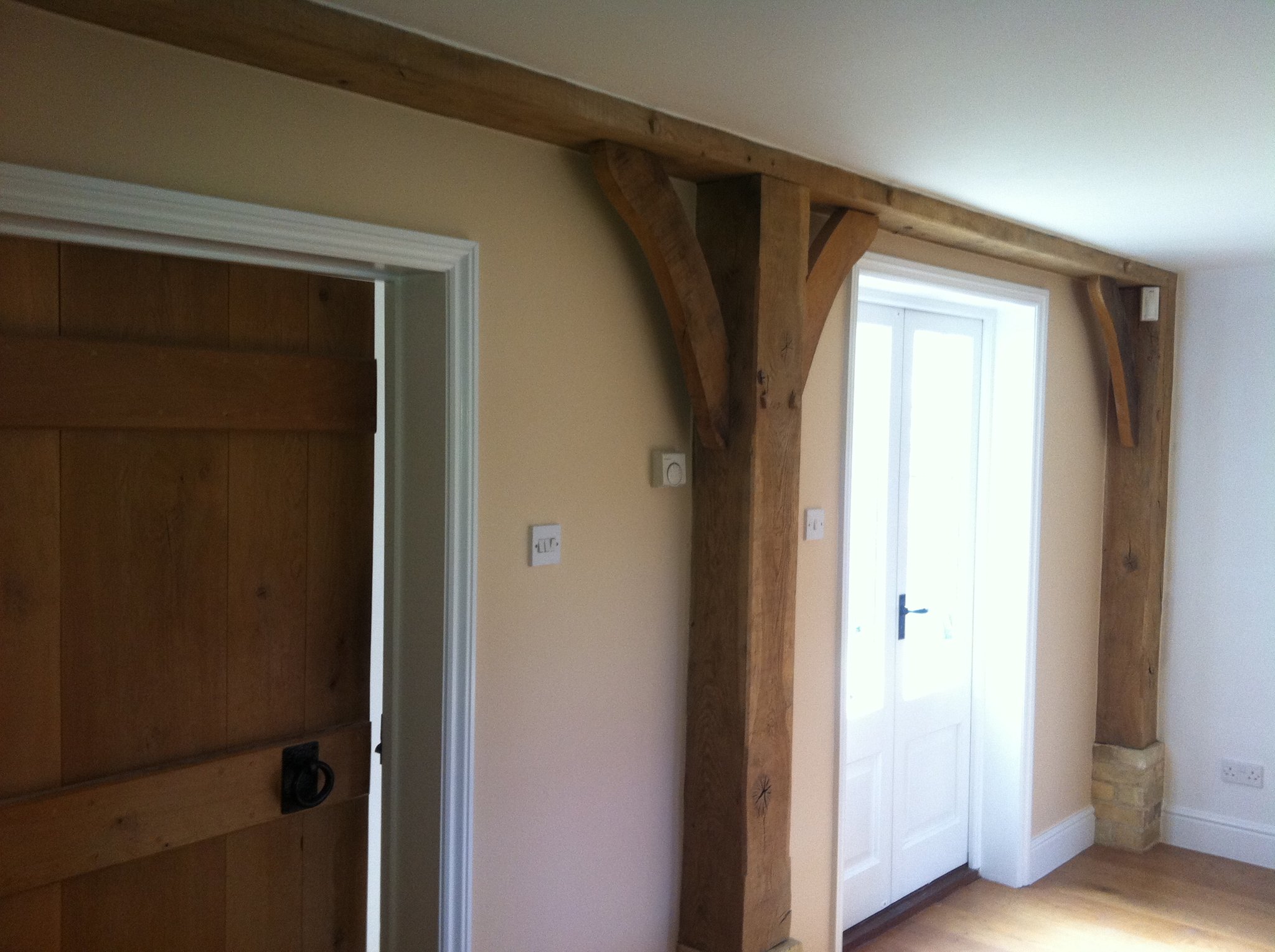 Oak beamed hallway with painted walls