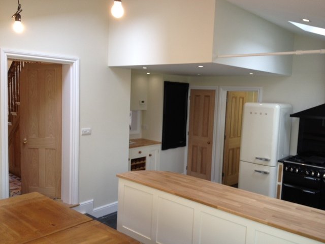Open plan kitchen with freshly painted walls